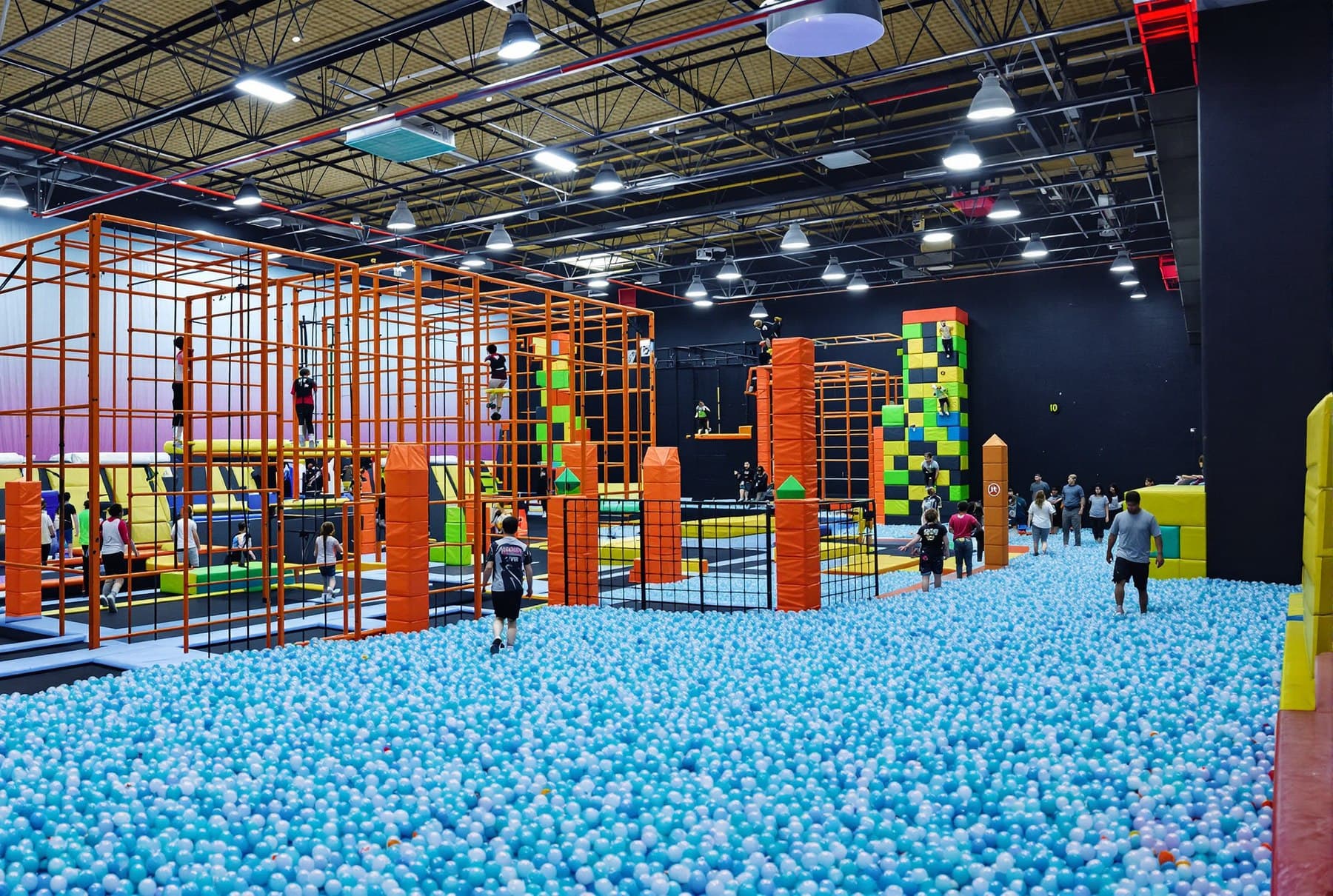 Trampoline courts on the main floor of an indoor adventure park